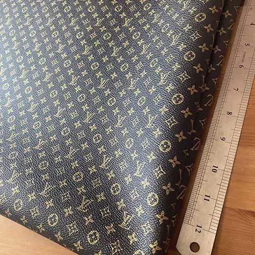 LL24 Black Vinyl fabric with mini gold Patterns