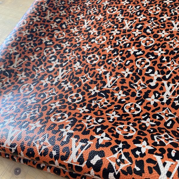 LL27 Leopard Leather Fabric with orange leopard pattern