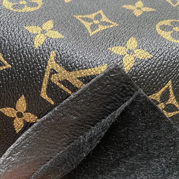 LL08 Black fabric with gold pattern