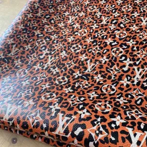 LL27 Leopard Leather Fabric with orange leopard pattern